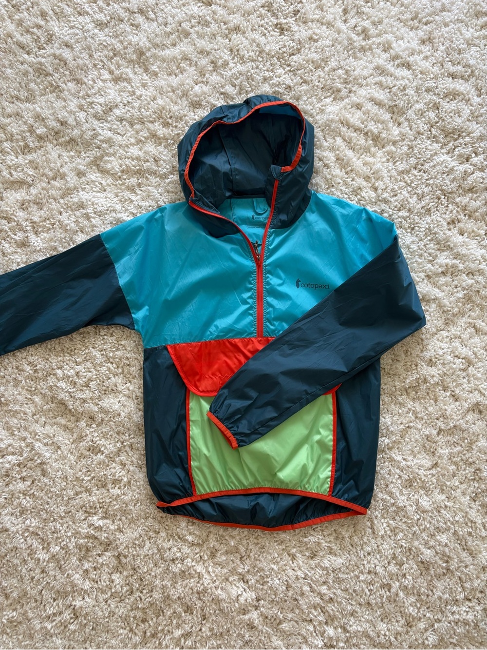 cotopaxi Teal Jacket with Orange Zipper Accents